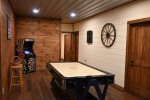 Large Game Room sporting Air Hockey and Video Console